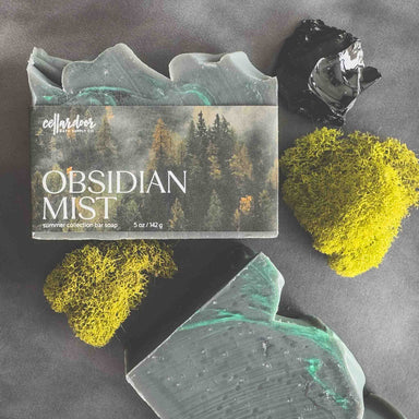 Obsidian Mist soap with packaging on a dark surface